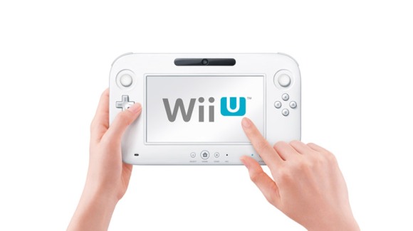 A promotional image of the Wii U controller with a finger pointing at the 'U' in the logo.